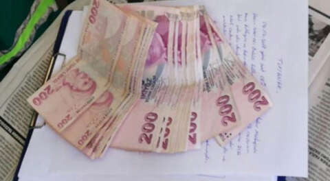 Temizlik işçisi çöpte bulduğu parayı polise teslim etti